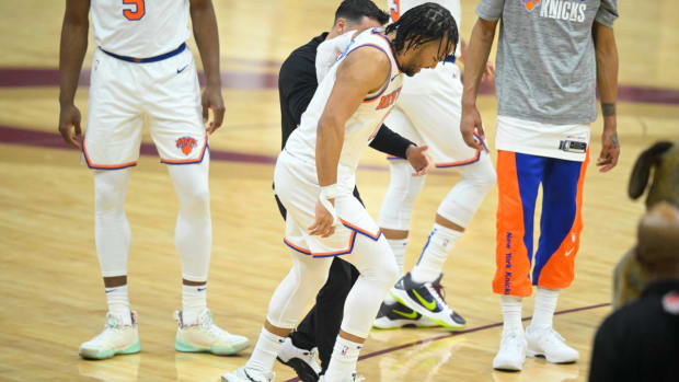 Jalen Brunson limps off the court.
